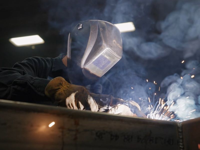 mid-city-steel-about-meet-the-team-fabrication-team-welder-metal-sparks-800x600
