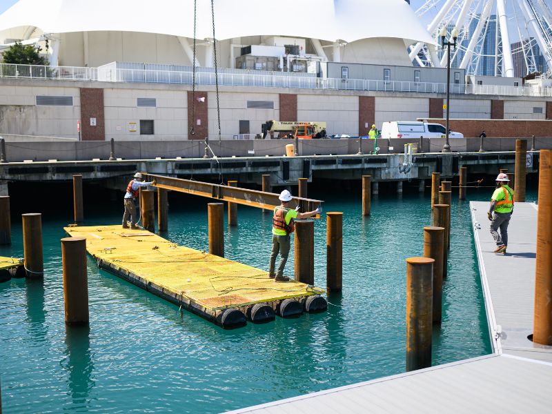 mid-city-steel-about-three-workers-guiding-metal-beam-navy-pier-800x600