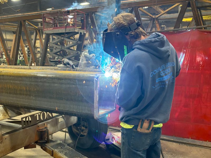 mid-city-steel-about-worker-welding-edge-of-metal-beam-800x600