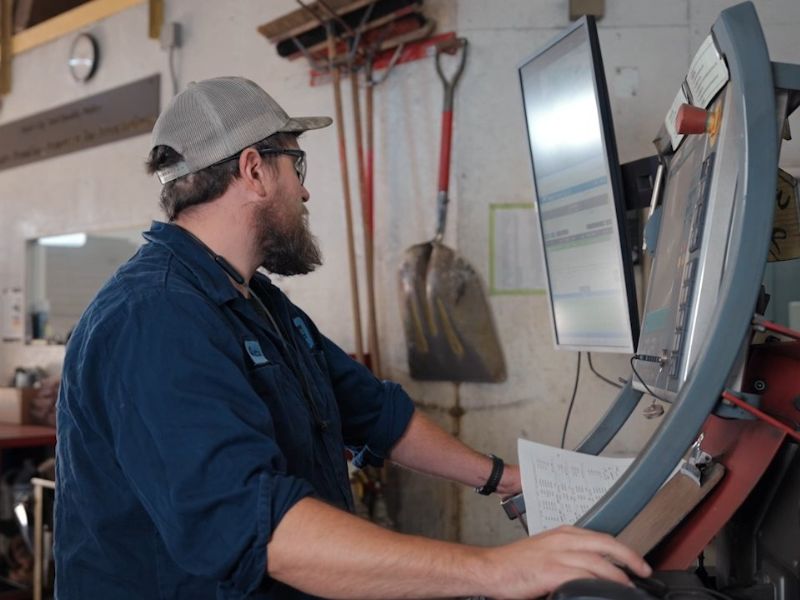 mid-city-steel-careers-man-working-at-machine-screen-safety-glasses-employee-worker-800x600
