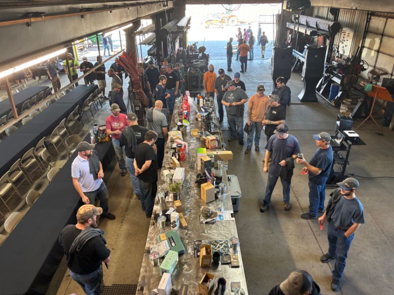 mid-city-steel-company-culture-workers-employees-work-events-prize-table-chatting-MCS-days-800x600