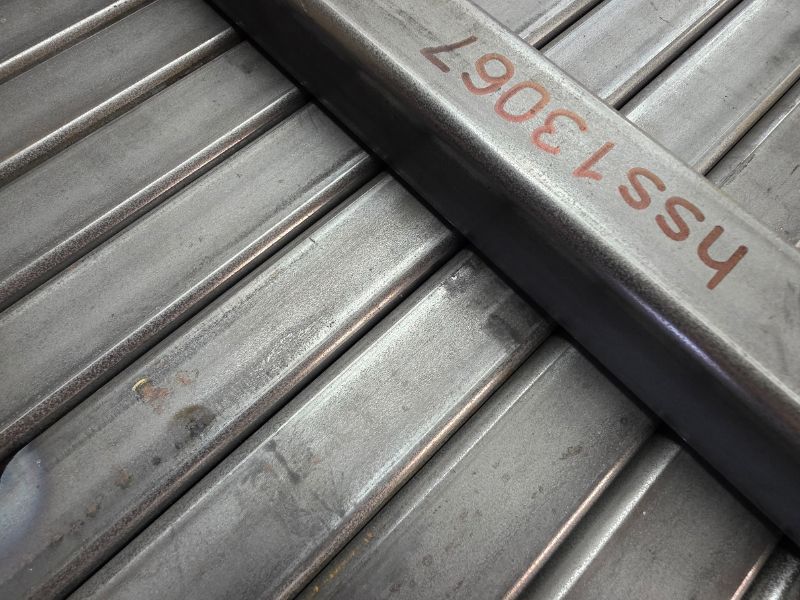 mid-city-steel-fabrication-small-details-metal-beams-lined-up-800x600