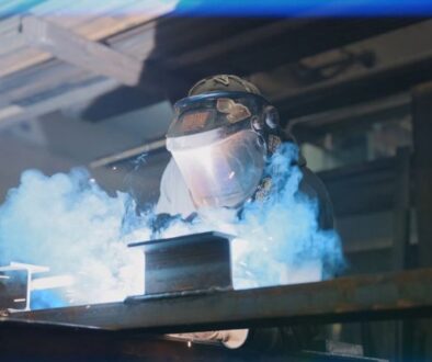 mid-city-steel-tough-job-team-engineering-excellence-welder-mask-safety