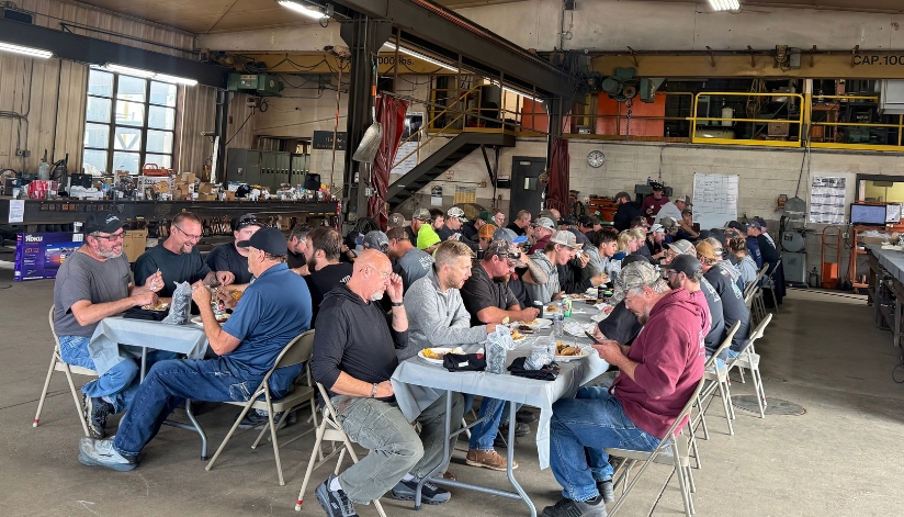 Mid-City Steel employees gather for a company meal inside the La Crosse, Wisconsin fabrication facility during Mid-City Steel Days in September 2026.